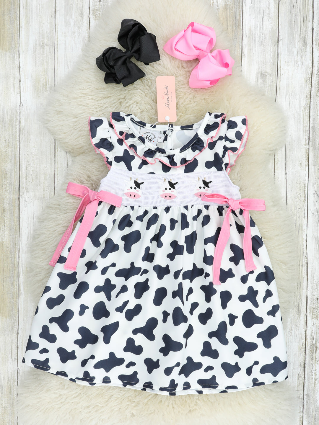 Smocked Cow Print Bow Ruffle Dress